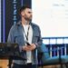 Chris Giancarlo speaking at a conference about digital assets and regulatory frameworks.