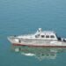 US Navy ships patrolling the Strait of Hormuz amidst heightened tensions and regulatory changes.