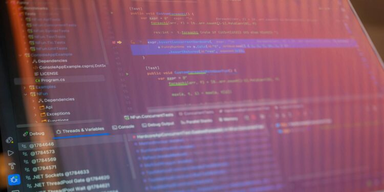A computer screen displays code, hinting at tech controversy in Alibaba's Qwen Code shutdown.