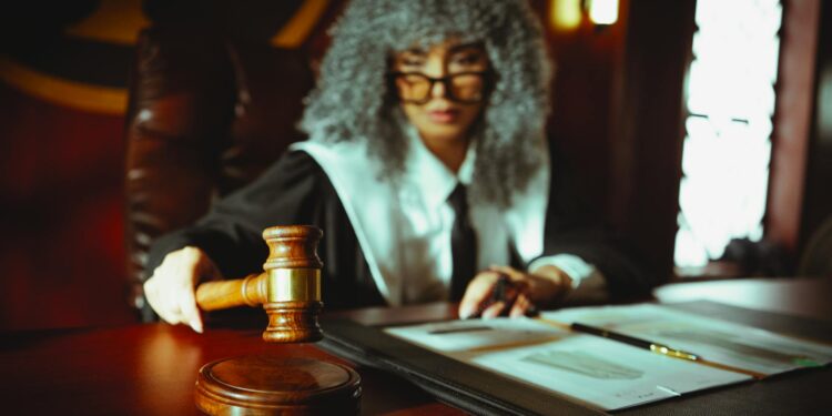 Former FTX engineer at a hearing, highlighting crypto regulation and legal proceedings.