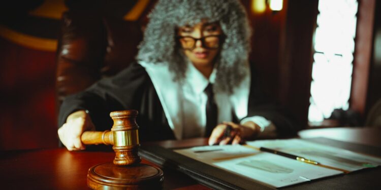 Courtroom scene with gavel, legal documents, and cryptocurrency symbols representing a crypto case.