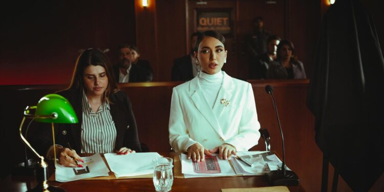 A courtroom scene with lawyers discussing AI legal implications and regulations.