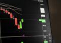 Charts showing declining cryptocurrency trading volumes with a downward trendline.