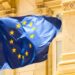 European Parliament building with EU flags, symbolizing regulatory challenges for Malta's iGaming.