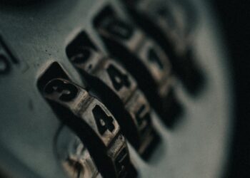 A close-up of a locked digital padlock symbolizing AI security concerns and regulations.