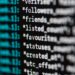 Computer screen displaying lines of code with a padlock symbol representing AI security concerns.