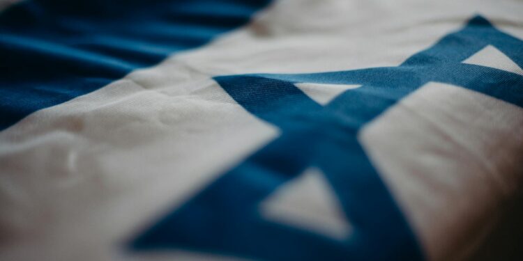 A digital representation of the Israeli flag alongside Solana's logo and cryptocurrency symbols.