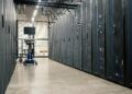 Data center with servers highlighting AI processing power for CoreWeave and Anthropic partnership.