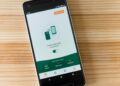 User interface of Tether's gas-free self-custodial wallet app on a smartphone screen.