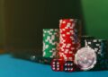 Gavel and scales of justice against a backdrop of gambling chips and online betting logos.