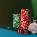 Gavel and scales of justice against a backdrop of gambling chips and online betting logos.