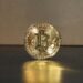 Bitcoin logo with a glitch effect, symbolizing technical issues in crypto news delivery.