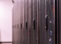 Aerial view of a large data center with servers and cooling systems, showcasing tech infrastructure.