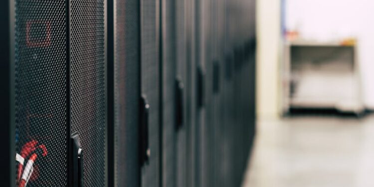 Technicians inspect advanced AI computing servers in a high-tech facility in China.