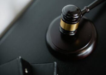 A gavel resting on financial documents, symbolizing justice in crypto fraud cases.