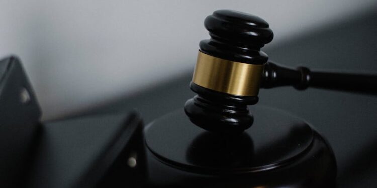 A courtroom scene with legal documents and a gavel, symbolizing financial regulation.