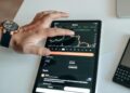 Investors examining cryptocurrency charts and Bitcoin gains on digital screens.