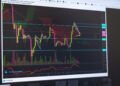 Darkened trading interface with warning signs indicating halted cryptocurrency transactions.