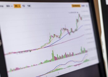 Bitcoin price graph surges upward with a backdrop of financial charts and articles on ETFs.