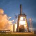 SpaceX rocket launch with financial graphs overlay, symbolizing IPO valuation surge.