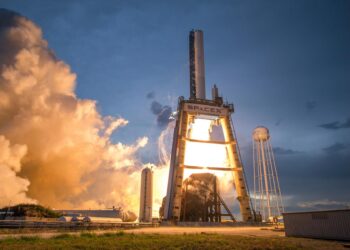 SpaceX rocket launching against a clear sky, symbolizing ambitious financial growth.