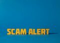 A computer screen displaying cryptocurrency symbols and scam alerts in bold red text.