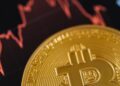 A digital illustration of the Bitcoin symbol surrounded by fluctuating financial graphs.