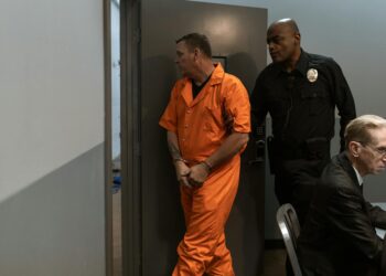 Gannon Ken Van Dyke being escorted by law enforcement after his insider trading arrest.