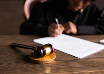 A gavel rests on legal documents representing the DOJ's fraud charges against the SPLC.