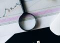 CFTC logo with financial charts and prediction market symbols in the background.