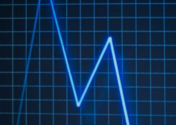 Kraken logo overlaid on a financial chart with declining valuation trends.