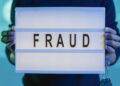 Law enforcement agents examining cryptocurrency hardware linked to a major fraud investigation.