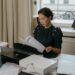A lawyer reviews financial documents with AI integration, highlighting filing discrepancies.