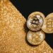 Gold bars and cryptocurrency symbols representing OCBC's tokenized gold fund initiative.