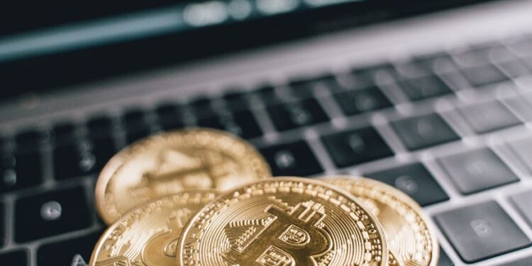 Bitcoin coins stacked with financial graphs and dollar signs, symbolizing crypto market growth.