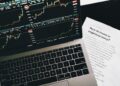 Cryptocurrency trading platforms logos with a financial graph in the background.