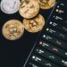 A smartphone displaying the Tether wallet app with USDT and Bitcoin transaction features.