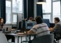 Team of engineers working on AI technology in a modern office setting with Pentagon models.