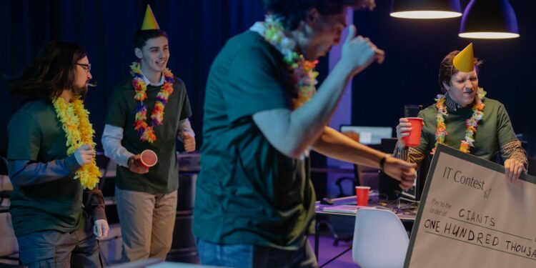A diverse team celebrates with a trophy and a check after winning a hackathon for blockchain innovation.