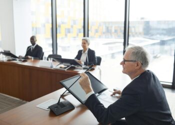 Officials discussing cryptocurrency regulations at a conference in Dubai.