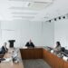KBank executives discussing blockchain remittances with Ripple representatives in a conference room.