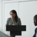 Vugar Usi speaking at a podium during MEXC's CEO announcement event.