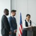 SEC Chair Paul Atkins speaking at a podium about crypto regulation strategy.