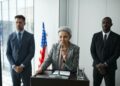 Government officials discussing cryptocurrency regulations in a conference room setting.