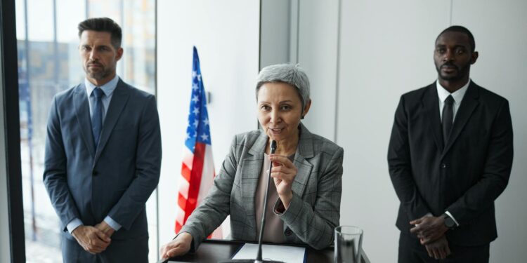 Government officials discussing cryptocurrency regulations in a conference room setting.