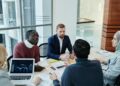 Investors discuss stablecoin strategies at a financial conference, highlighting Tether's support.