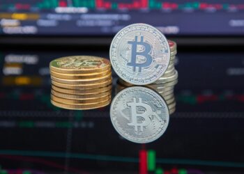 A gavel and cryptocurrency coins symbolizing regulation in financial markets.