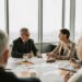 A business meeting with finance professionals discussing stablecoin regulations.