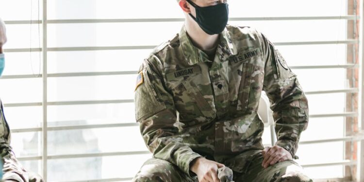 U.S. Army sergeant at a court hearing discussing insider trading allegations.