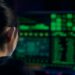 Police officers examining computer screens filled with cryptocurrency data and codes.